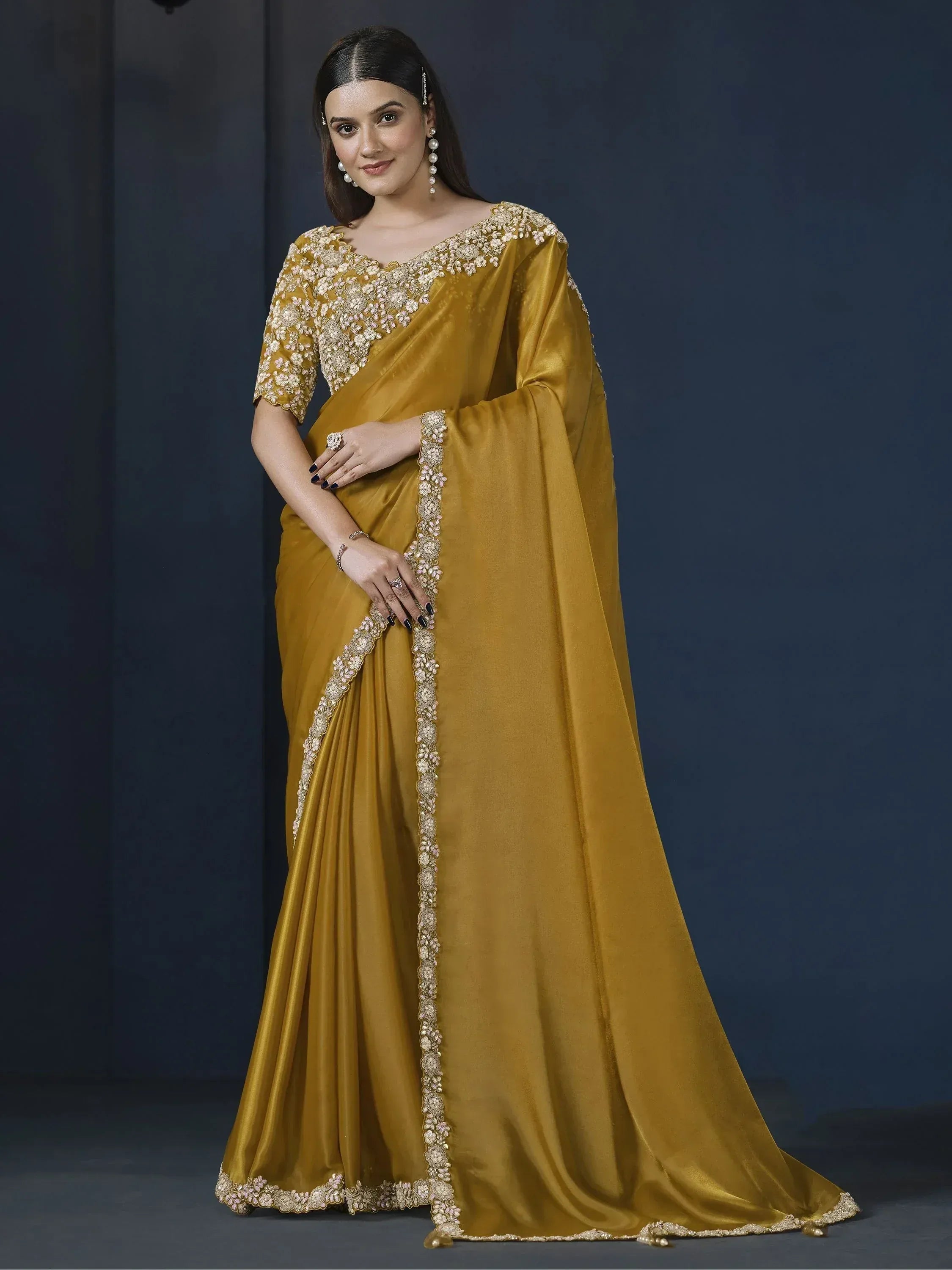 Mustard yellow designer saree with floral embroidery and embellished border for ethnic occasions