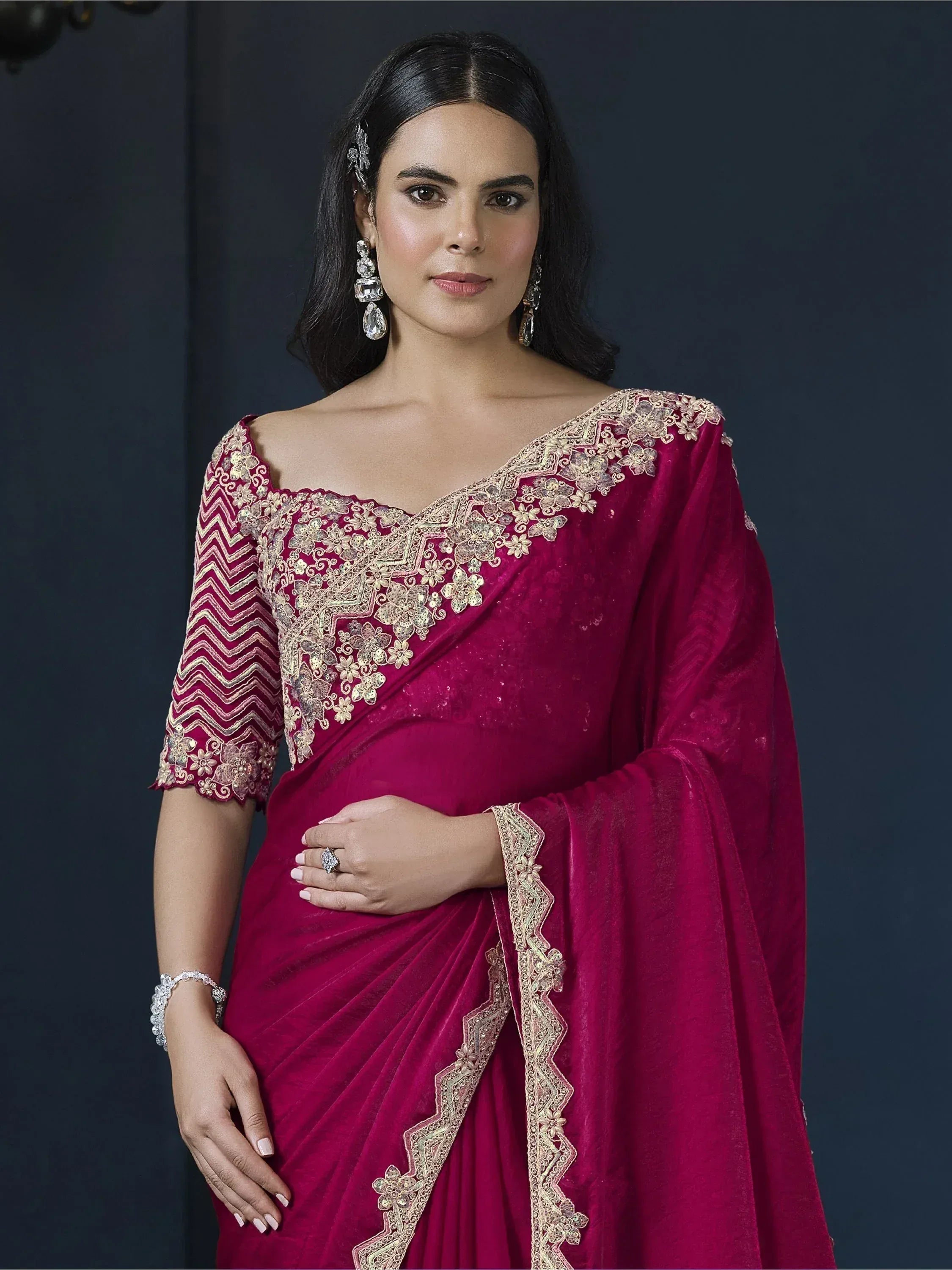 Elegant maroon velvet saree with gold embroidery, perfect for Indian ethnic occasions and festive events.