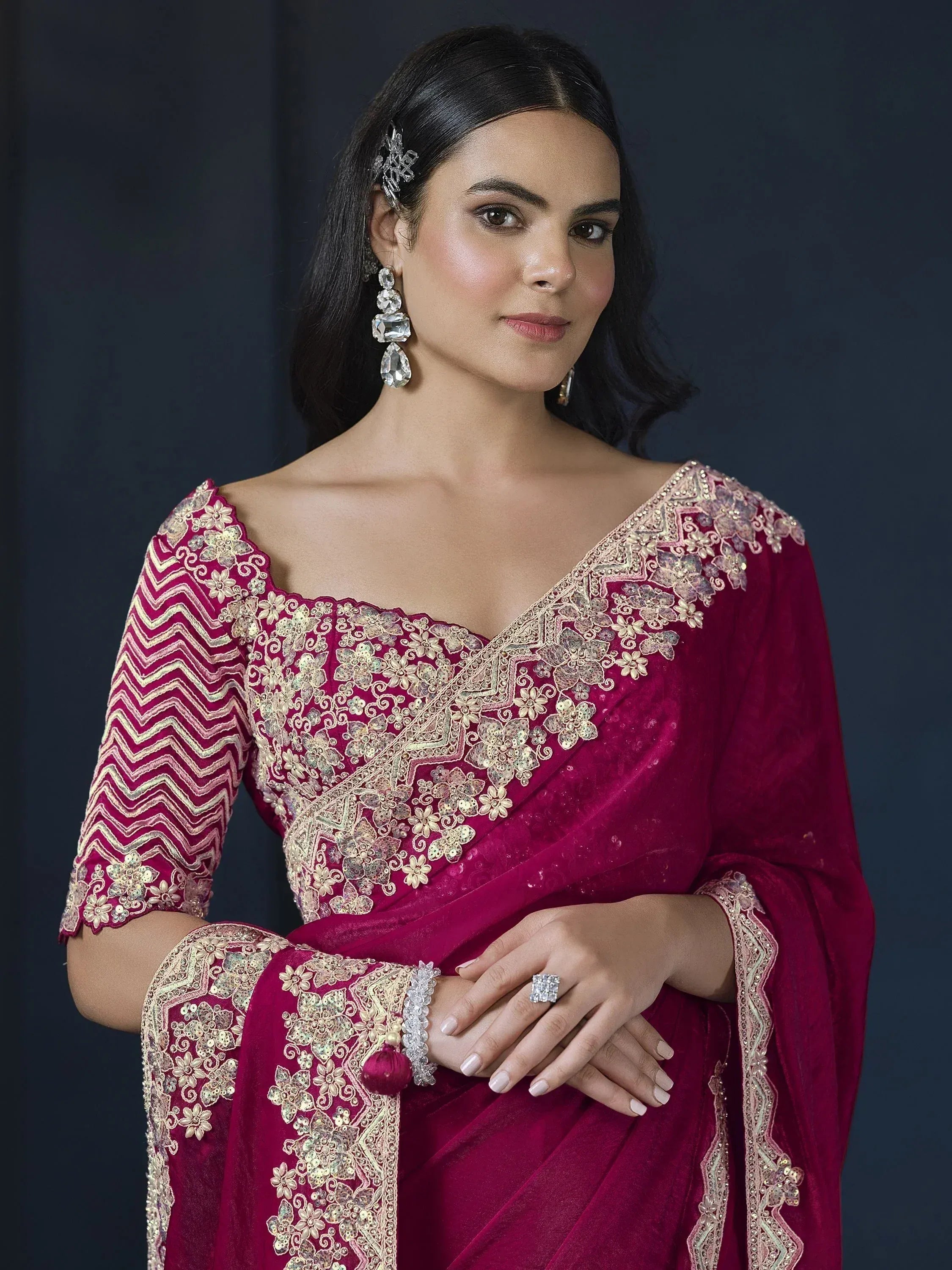 Elegant maroon velvet saree with gold floral embroidery and zari work, perfect for Indian ethnic occasions.