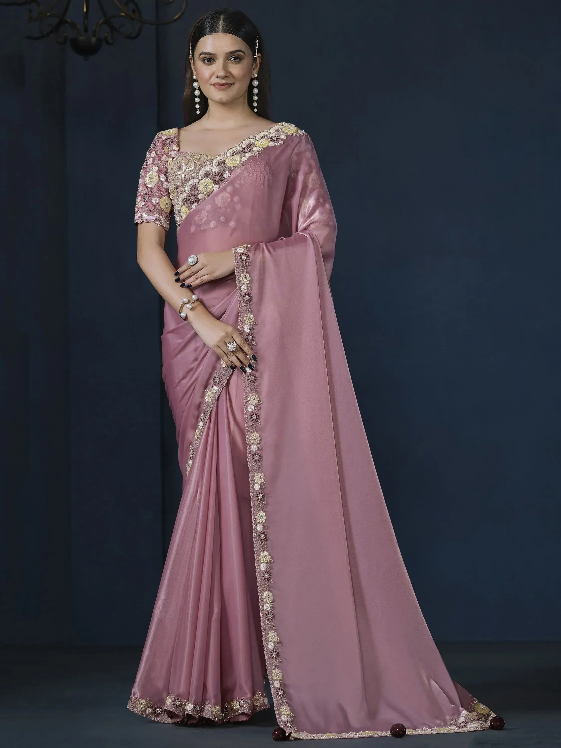 Elegant pink saree with floral embroidery and sequin work, perfect for Indian ethnic occasions.
