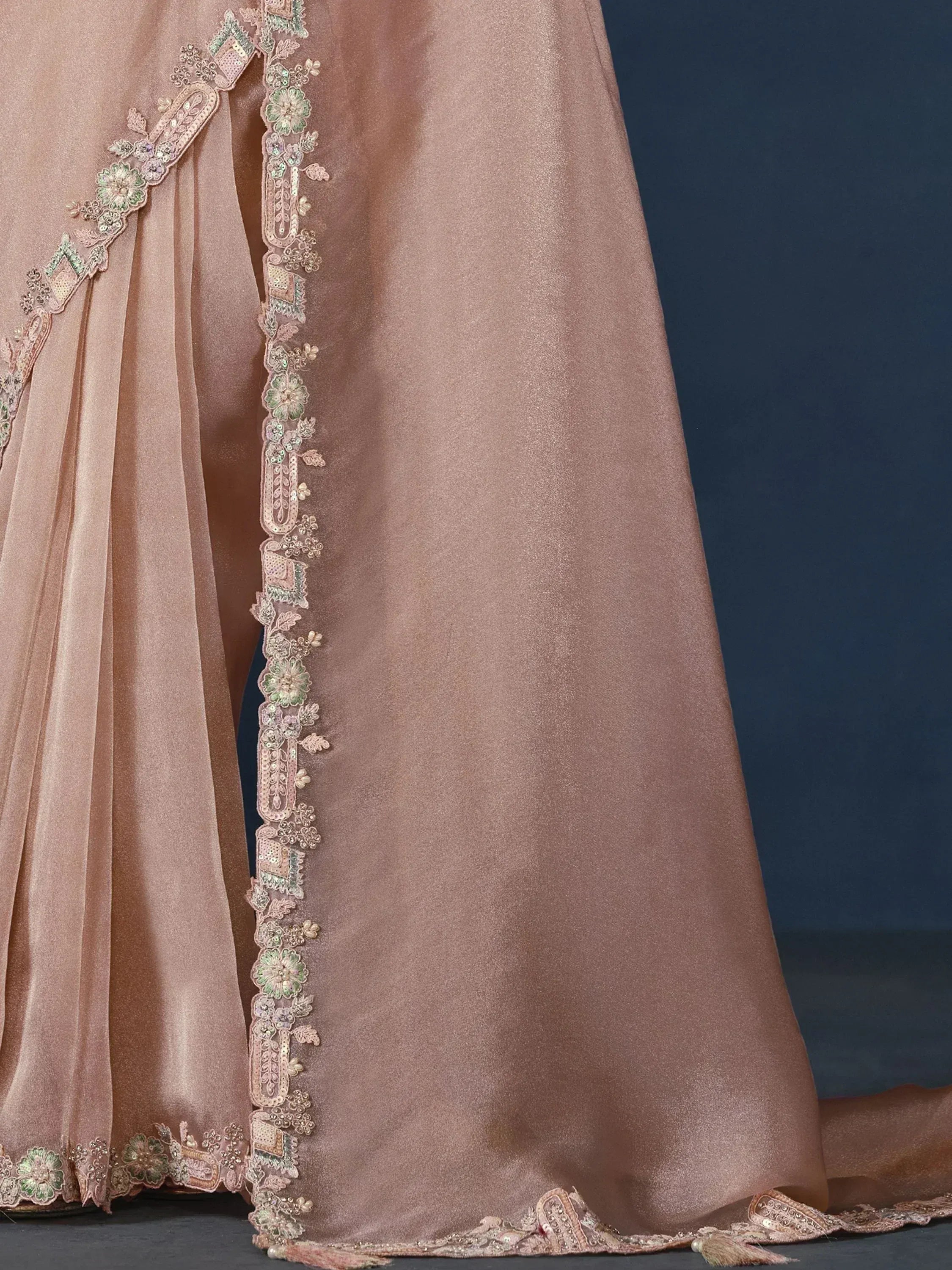 Elegant dusty pink lehenga with intricate floral embroidery and sequin detailing, perfect for Indian ethnic wear.