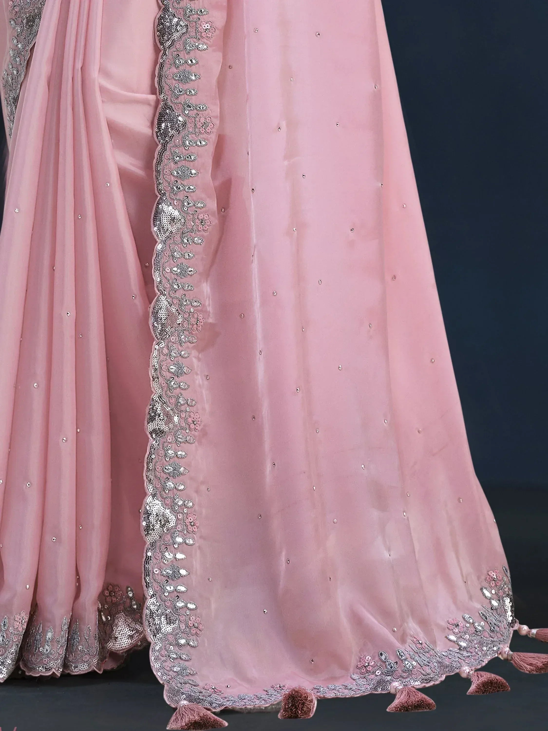 Pink ethnic gown with silver embroidery, sequins, and tassels for Indian wear
