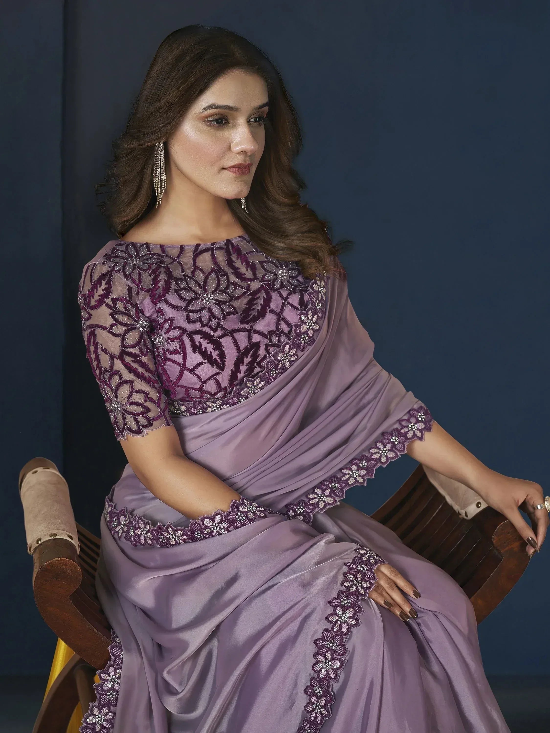 Elegant purple saree with floral embroidery and sequin detailing, perfect for Indian ethnic wear occasions.