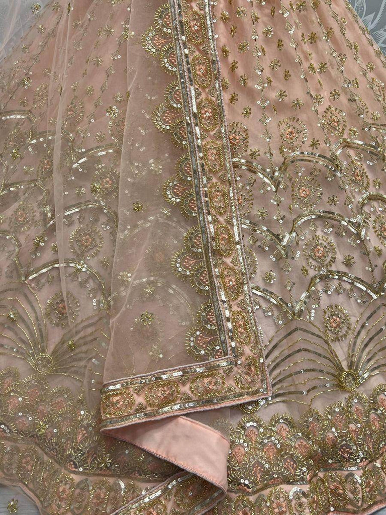 Glamorous Peach Sequined Embroiderey Net Reception Wear Lehenga Choli