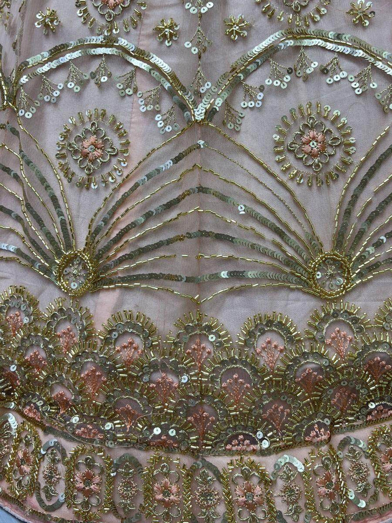 Glamorous Peach Sequined Embroiderey Net Reception Wear Lehenga Choli