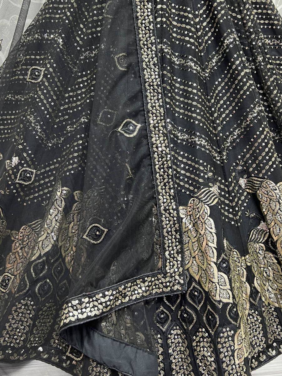Black ethnic lehenga with gold embroidery and sequin detailing, perfect for weddings and parties.