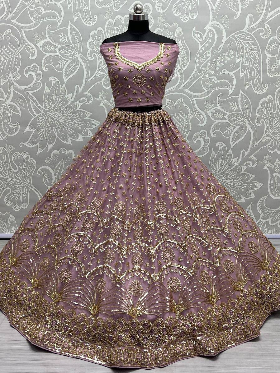 Elegant mauve lehenga choli with gold embroidery, perfect for Indian ethnic wear and festive occasions.