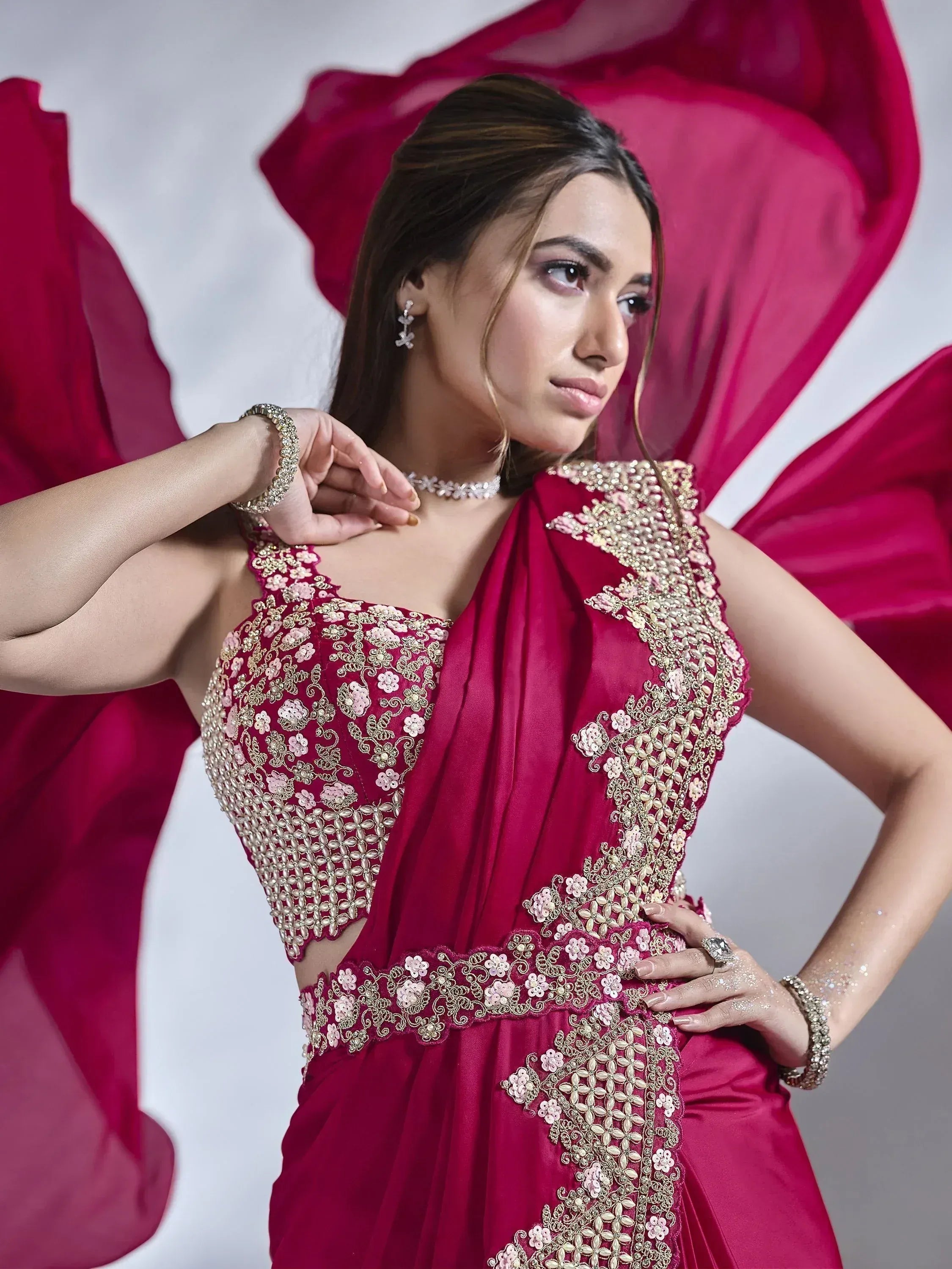 Elegant maroon ethnic gown with gold floral embroidery, perfect for Indian weddings and festive occasions.