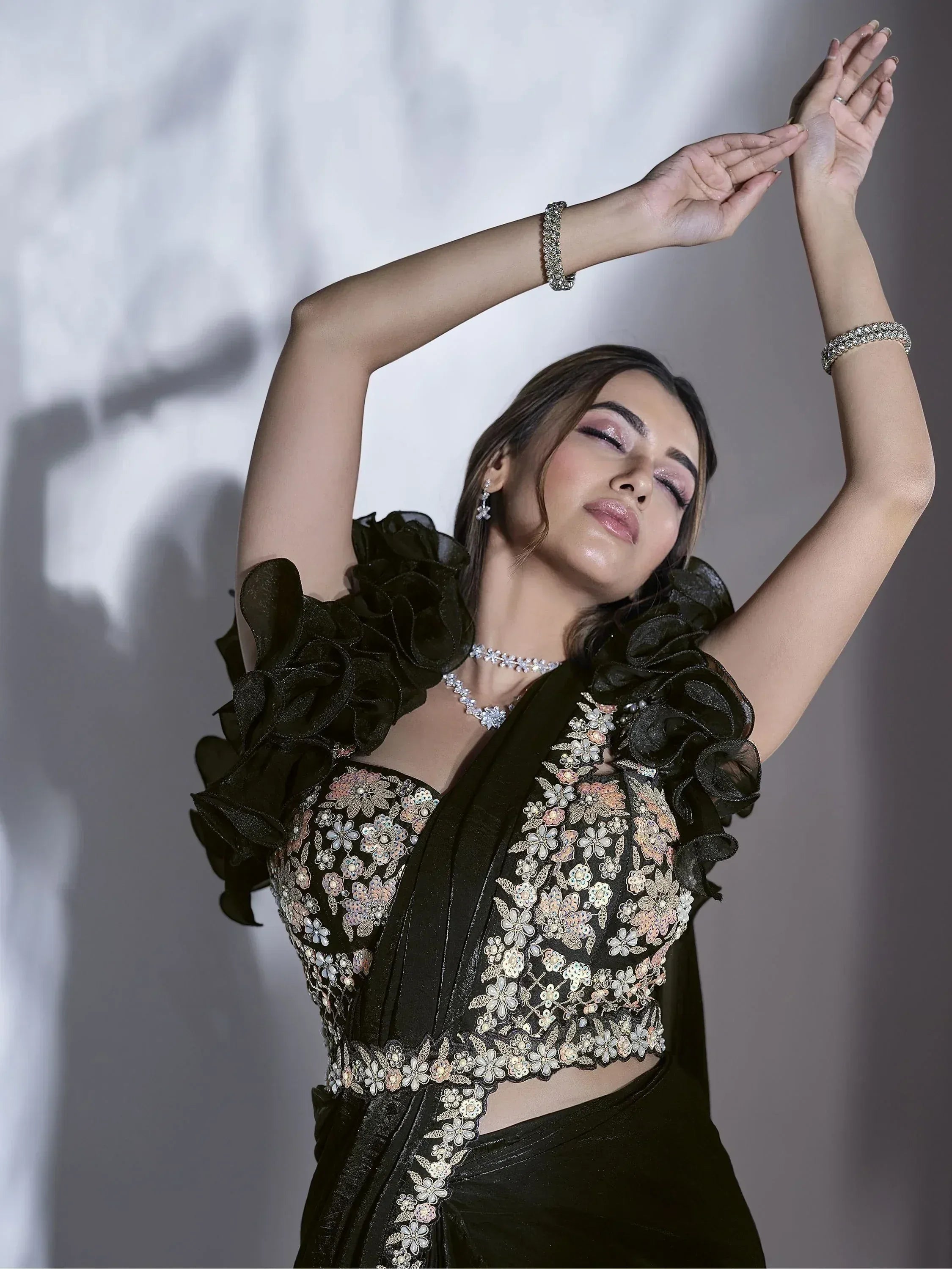 Black floral embroidered saree with ruffled sleeves, perfect for Indian ethnic wear events