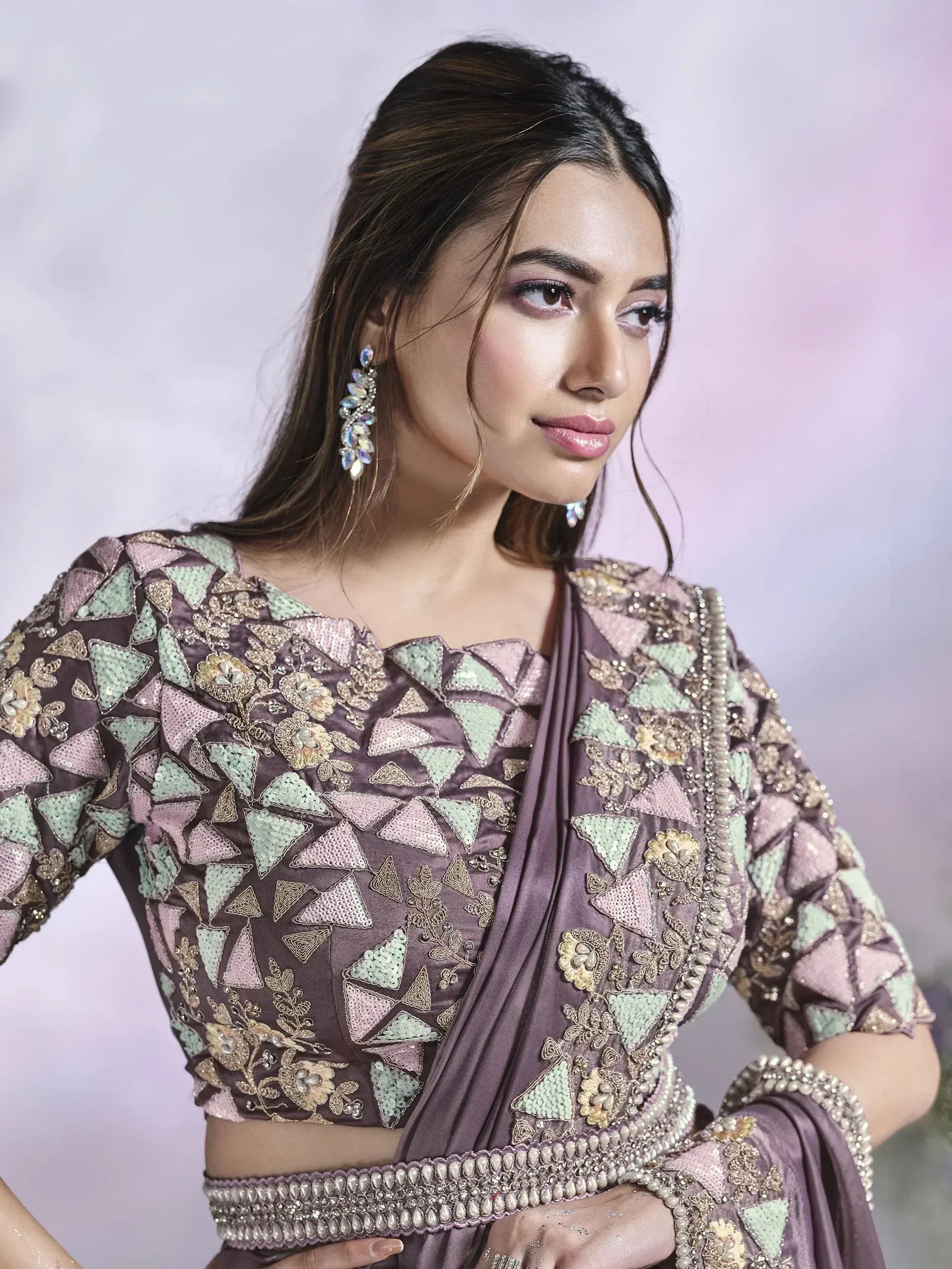 Elegant purple lehenga choli with geometric sequin and floral embroidery, perfect for Indian ethnic wear.