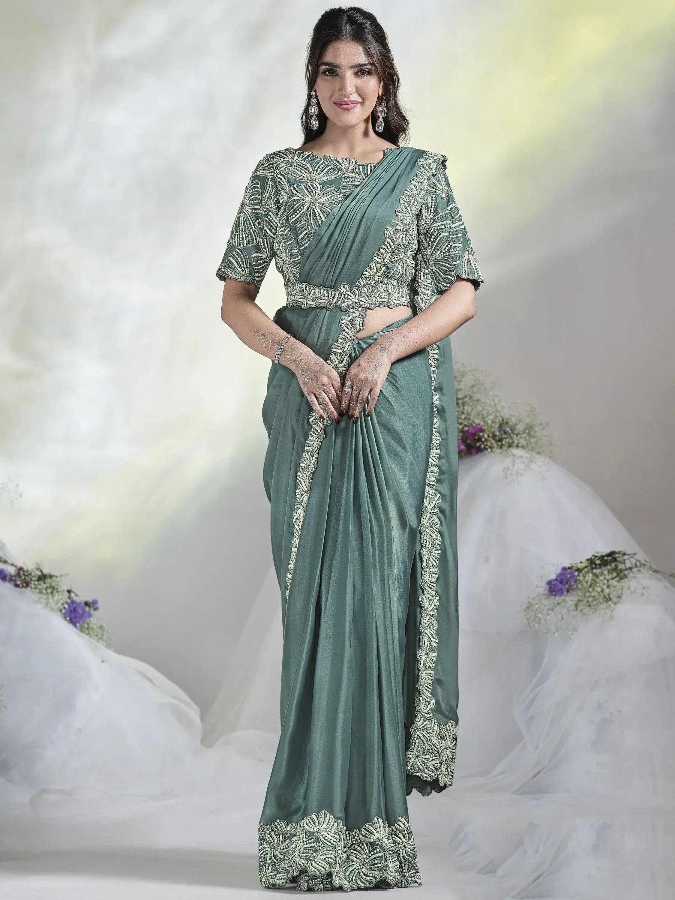 Elegant green saree with intricate silver embroidery, perfect for Indian ethnic occasions