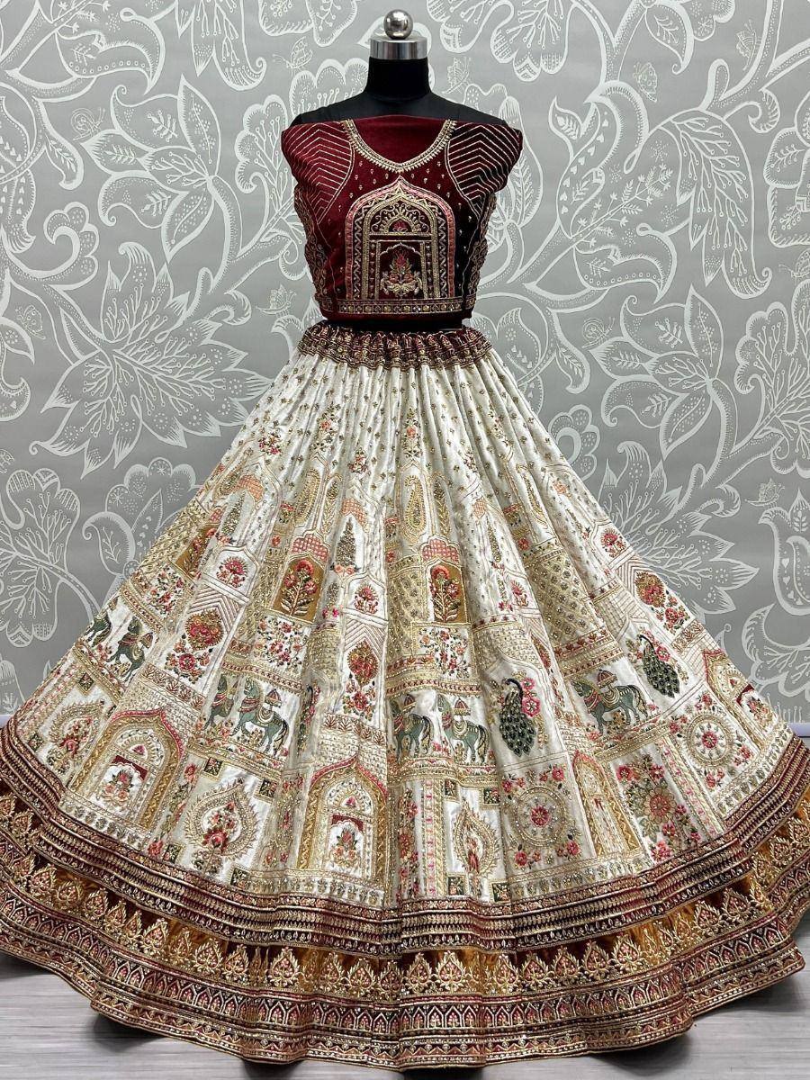 Designer lehenga choli with intricate embroidery, floral and elephant motifs, perfect for Indian ethnic wear