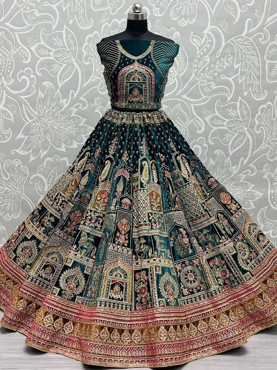 Dark green designer lehenga choli with intricate gold and pink embroidery, perfect for Indian ethnic wear occasions.