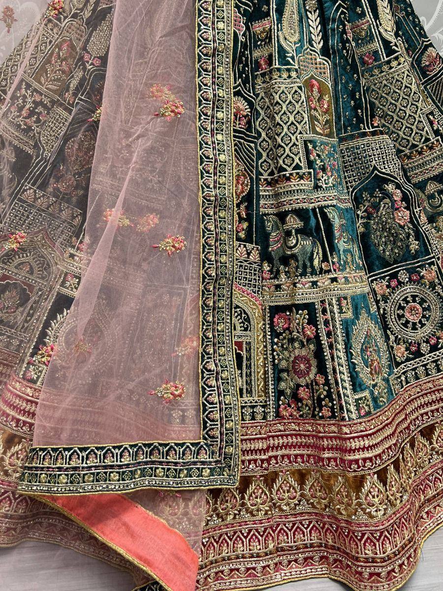 Designer lehenga choli with intricate embroidery, floral motifs, and elephant detailing in teal and gold