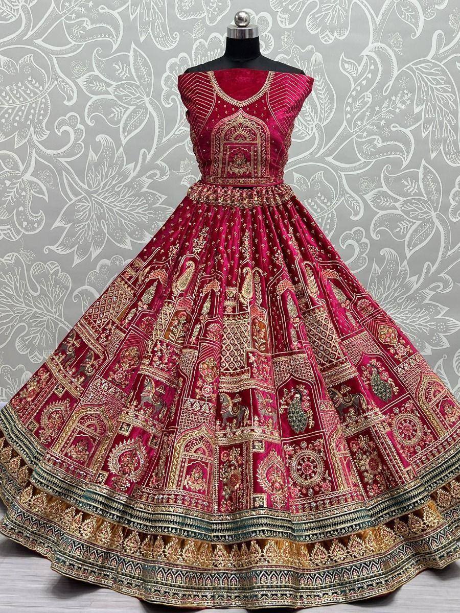 Luxury maroon lehenga choli with intricate gold embroidery and temple motifs, perfect for Indian weddings and festivals.