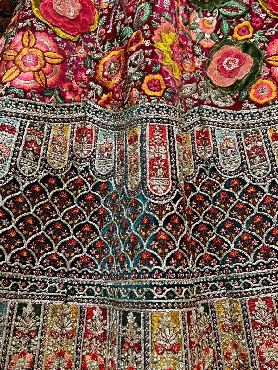 Richly embroidered Indian lehenga with floral motifs and intricate zari work, perfect for ethnic occasions.