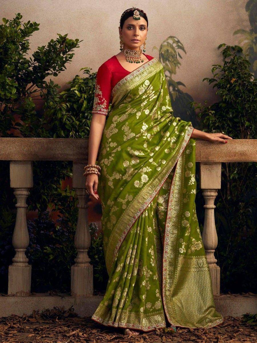 Green floral saree with gold embroidery, paired with red blouse, ideal for Indian ethnic occasions