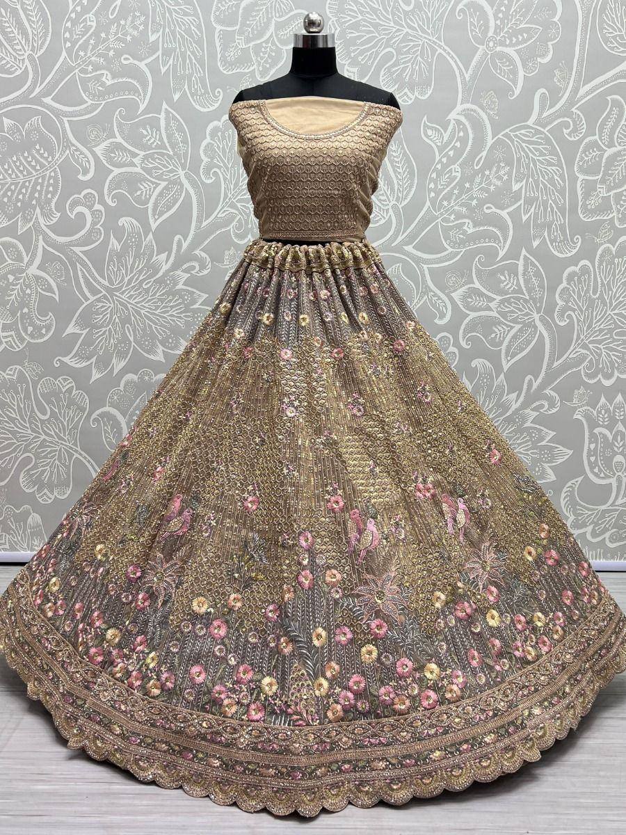 Elegant gold lehenga choli with floral embroidery, perfect for Indian ethnic wear and festive occasions.