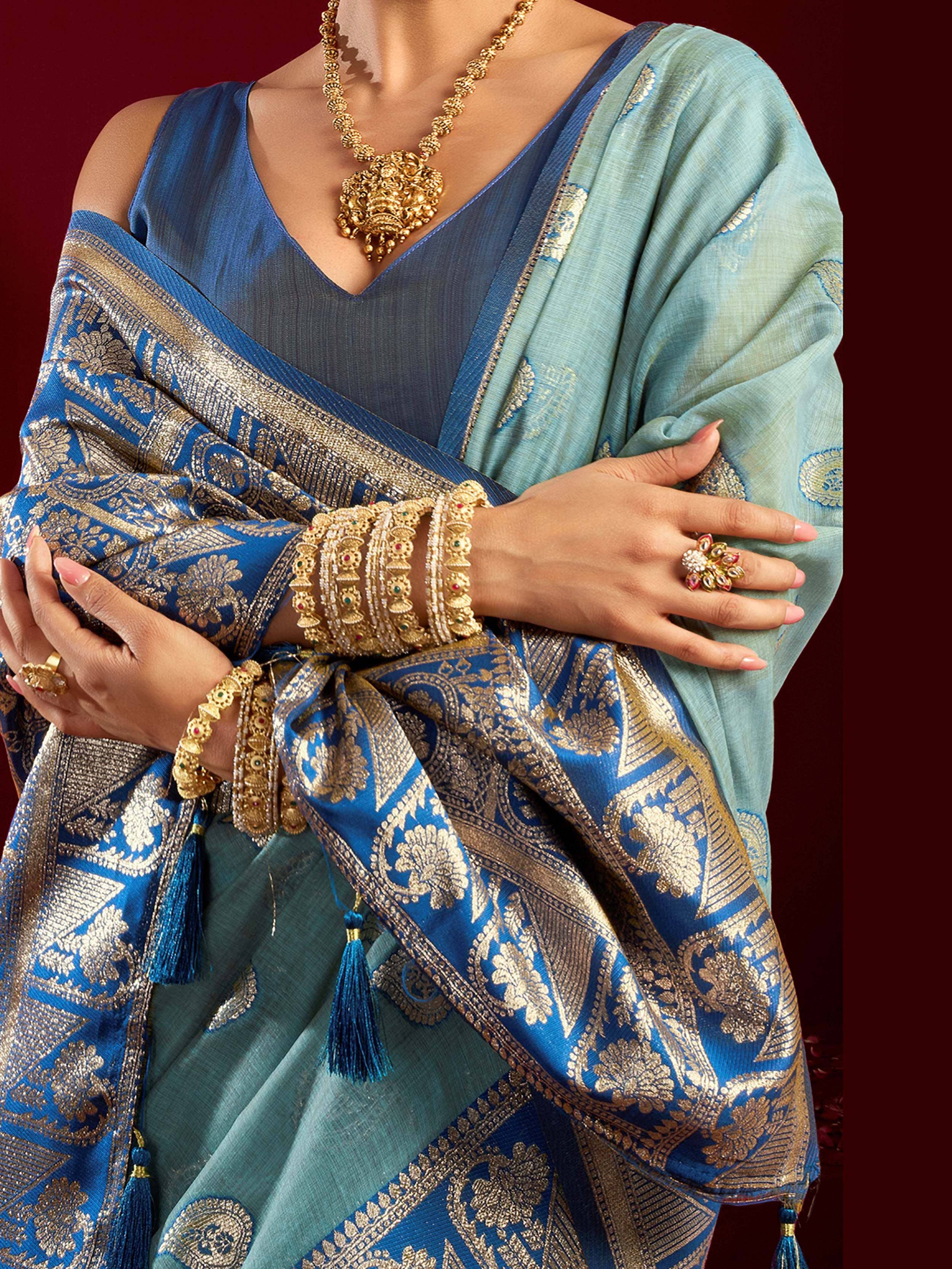 Blue and gold embroidered saree with traditional jewelry for ethnic wear
