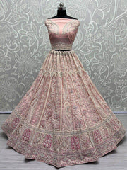 Adorable Peach Embroidered Net Engagements Wear Lehenga Choli