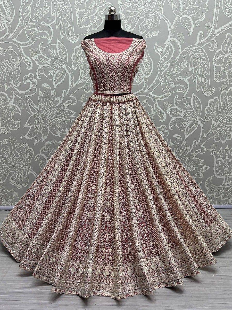 Elegant maroon and gold embroidered lehenga choli with flared skirt, perfect for Indian weddings and festivals