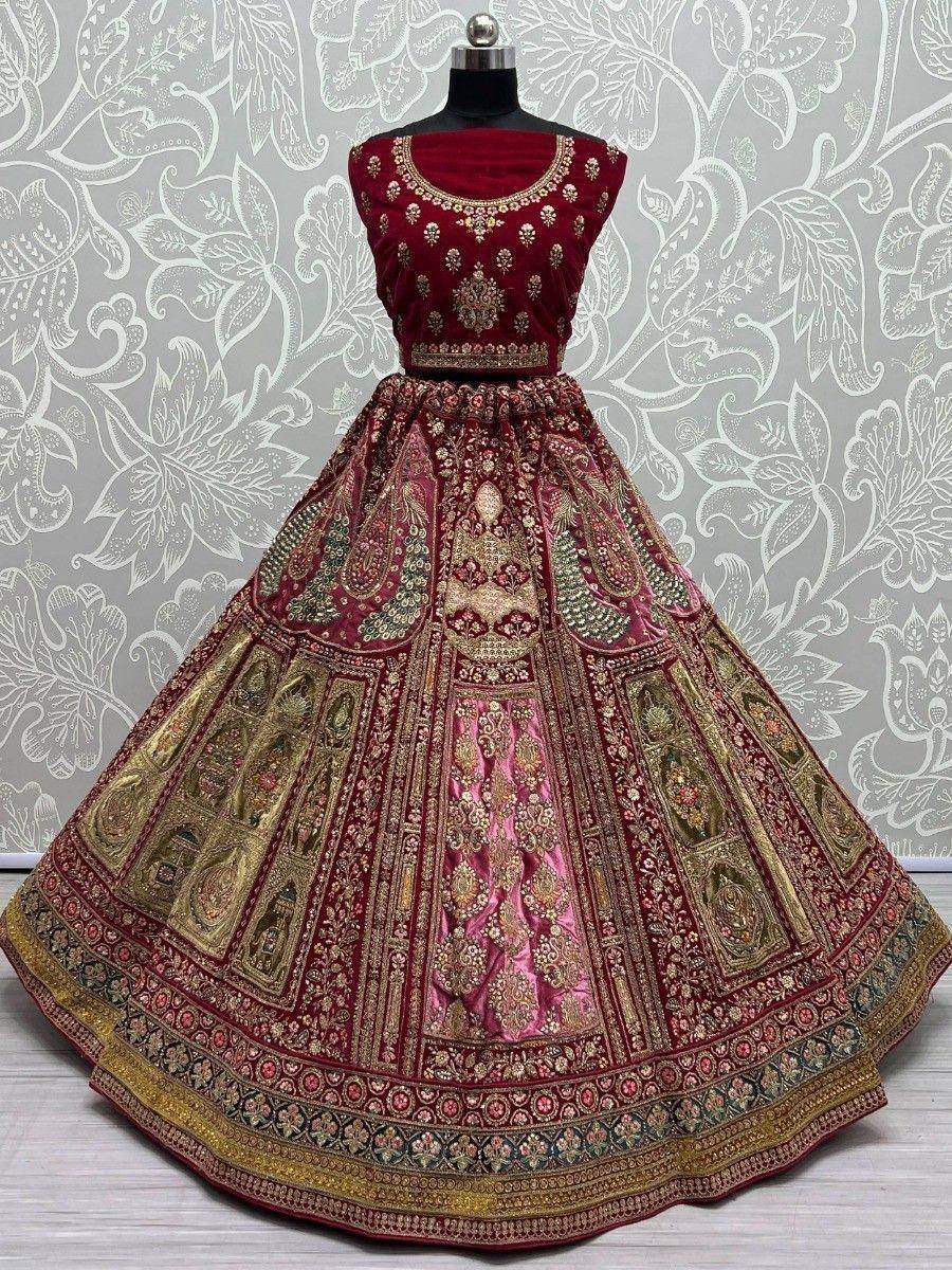 Maroon velvet designer lehenga choli with gold embroidery and floral patterns, perfect for Indian weddings