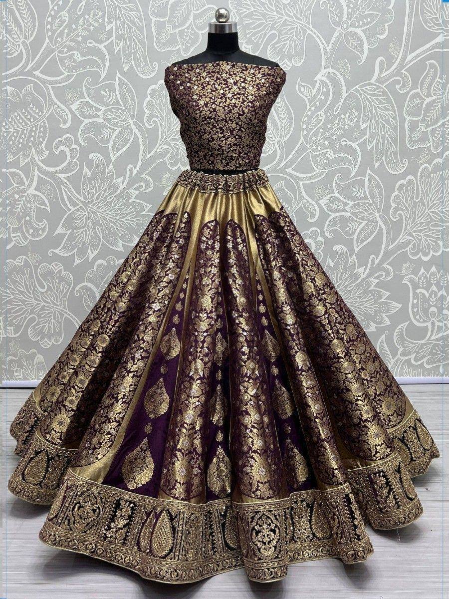 Elegant purple and gold embroidered lehenga choli with off-shoulder blouse, perfect for weddings and festivals.