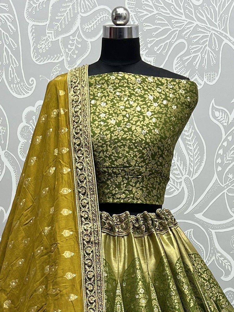 Green and gold embroidered lehenga choli with matching dupatta, perfect for Indian ethnic wear occasions.