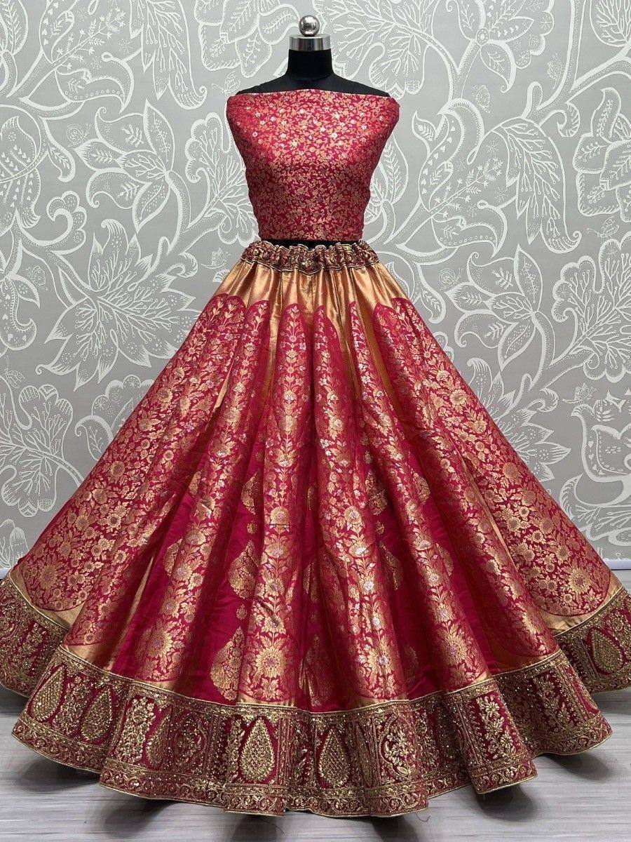 Red and gold embroidered lehenga choli with floral motifs, perfect for Indian weddings and festive occasions.