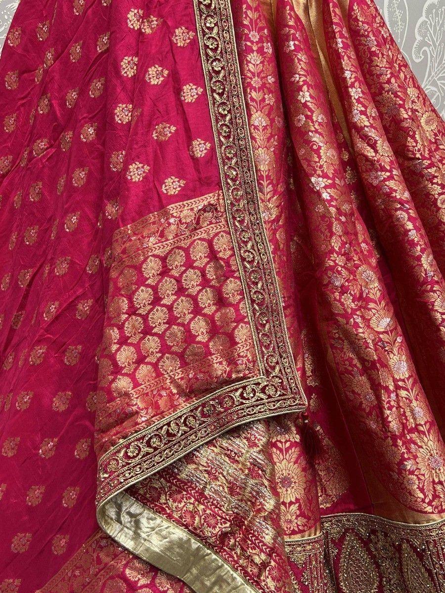 Rich maroon lehenga choli with gold floral embroidery and intricate border detailing, perfect for Indian ethnic wear.