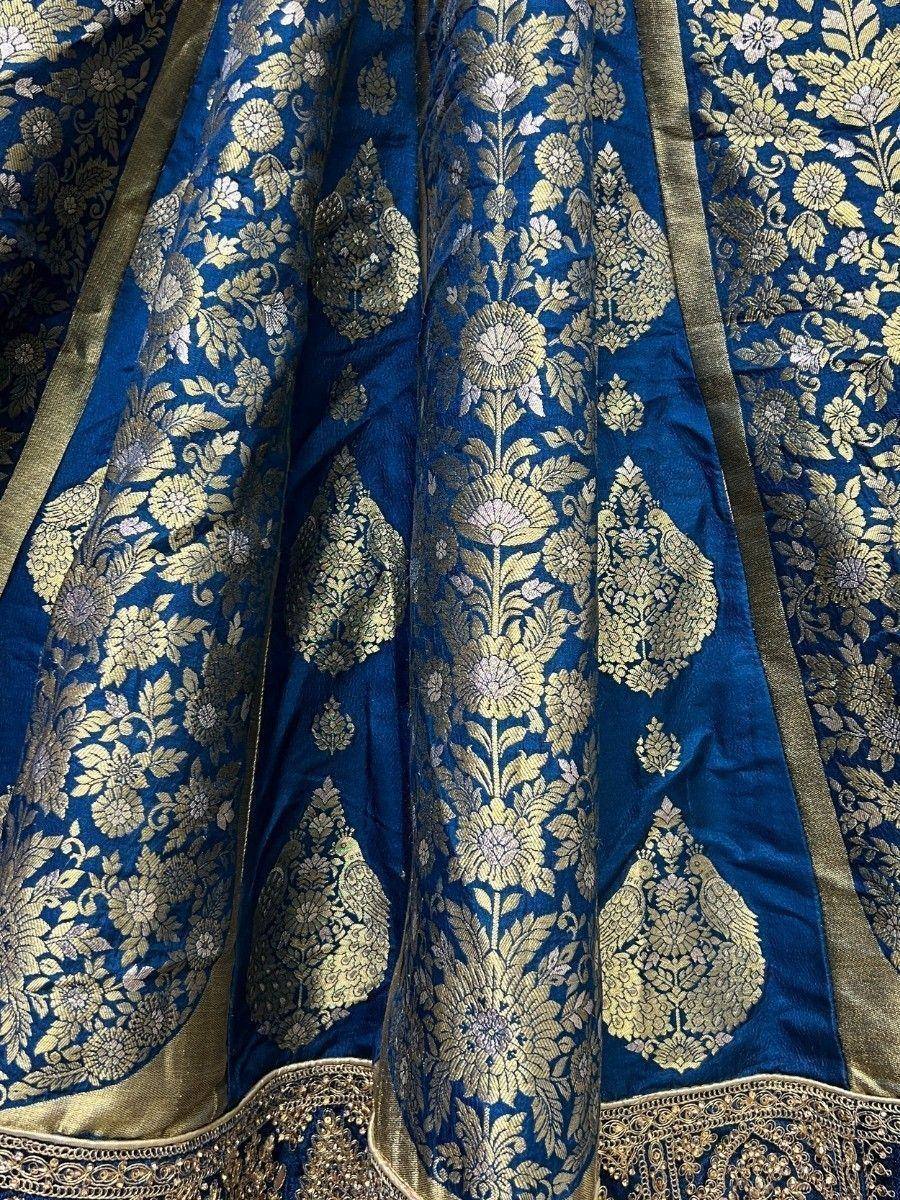 Blue and gold floral brocade lehenga fabric with intricate embroidery details
