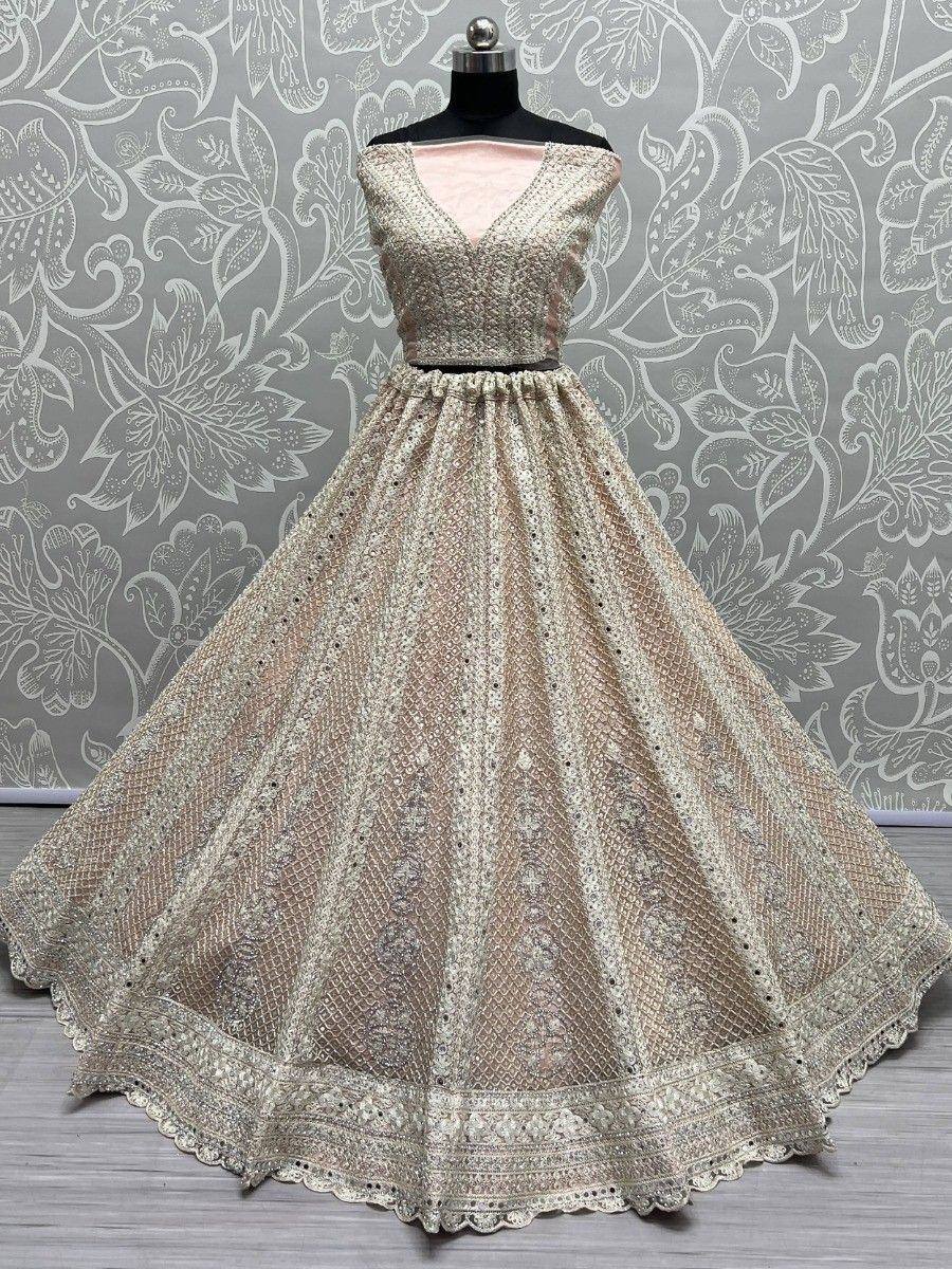 Elegant beige embroidered lehenga choli with net skirt, perfect for Indian weddings and festive occasions