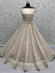 Beautiful Peach Embroidered Net Engagement Wear Lehenga Choli