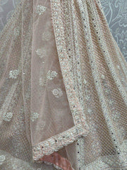 Beautiful Peach Embroidered Net Engagement Wear Lehenga Choli