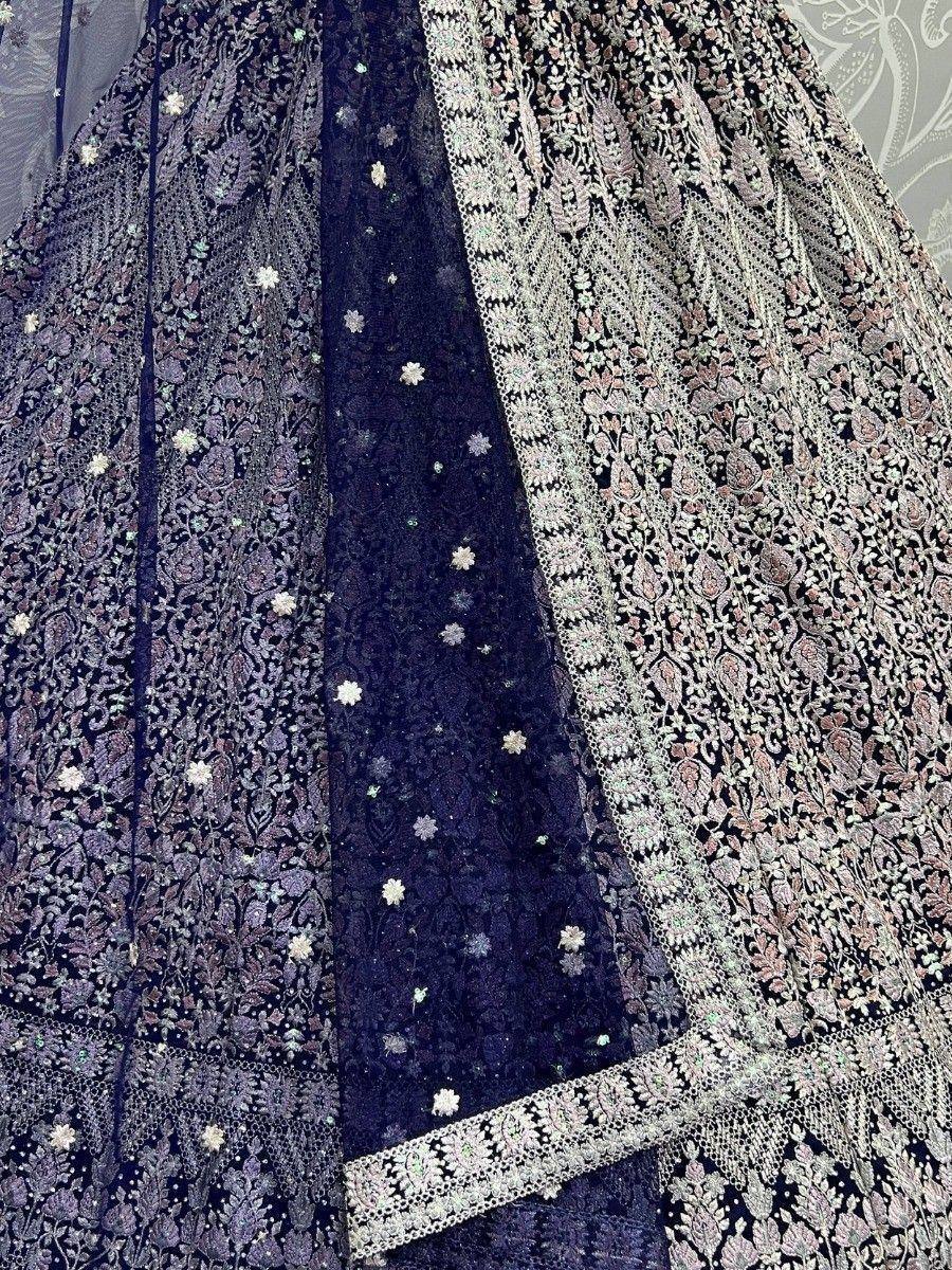 Elegant black embroidered lehenga with floral patterns and lace detailing