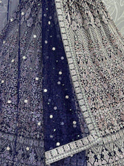 Fascinating Navy Blue Embroidered Net Reception Wear Lehenga Choli