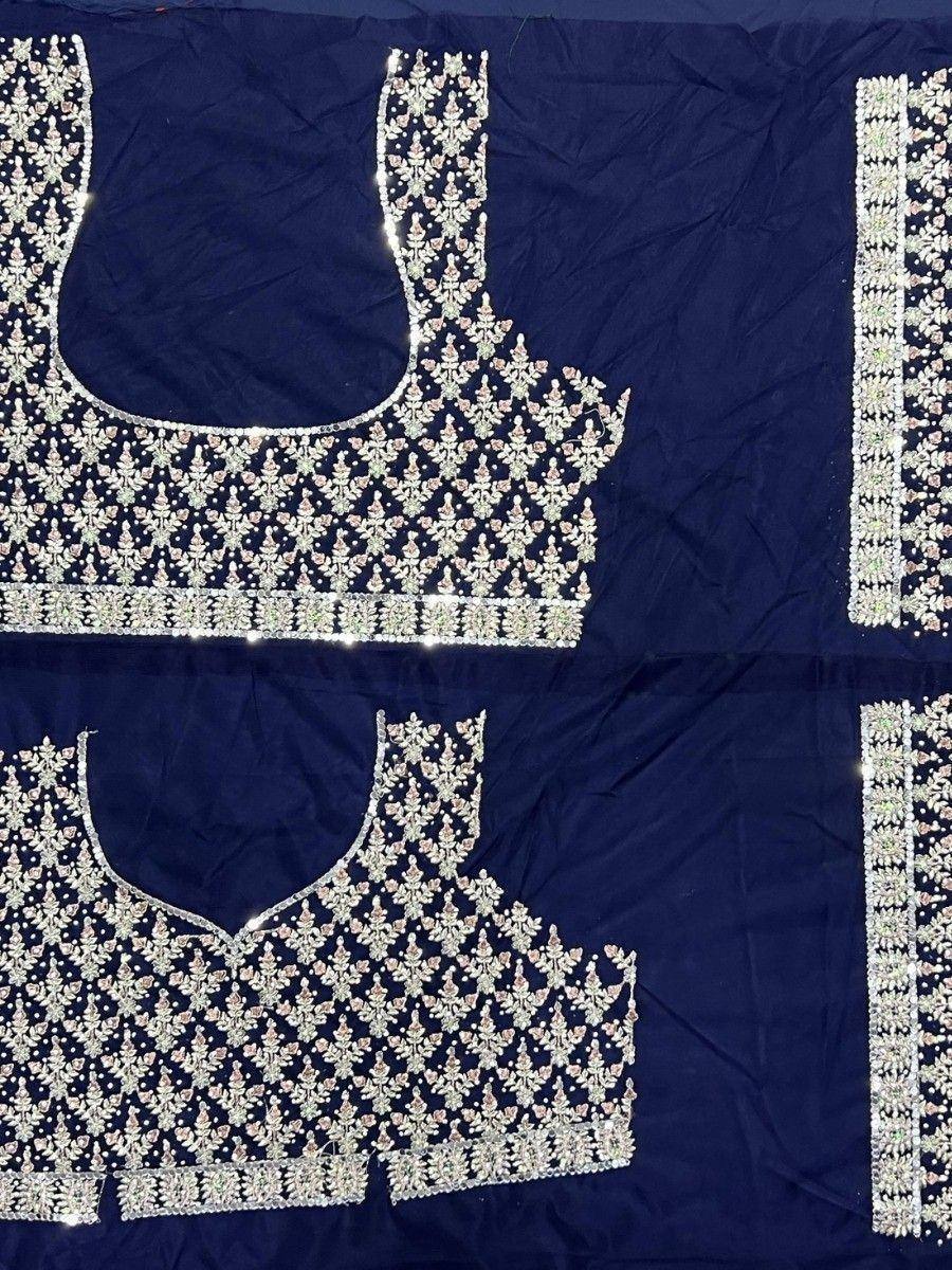 Navy blue designer lehenga choli with intricate silver and pink embroidery, perfect for Indian ethnic wear.