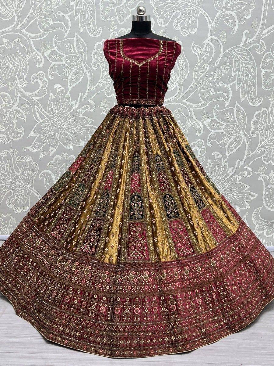 Maroon and gold designer lehenga choli with intricate embroidery, perfect for Indian ethnic wear occasions.