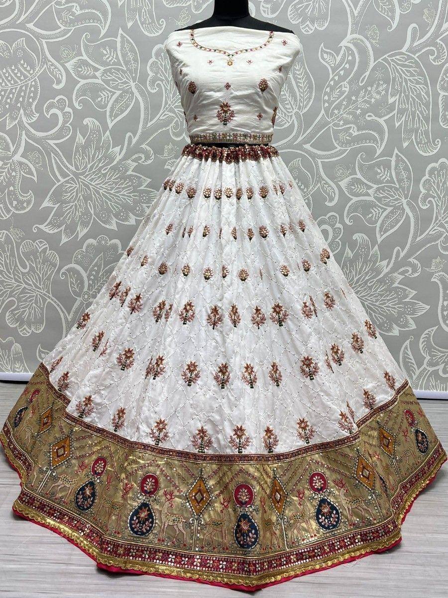 White embroidered lehenga choli with gold border, ethnic Indian wear for weddings and festivals