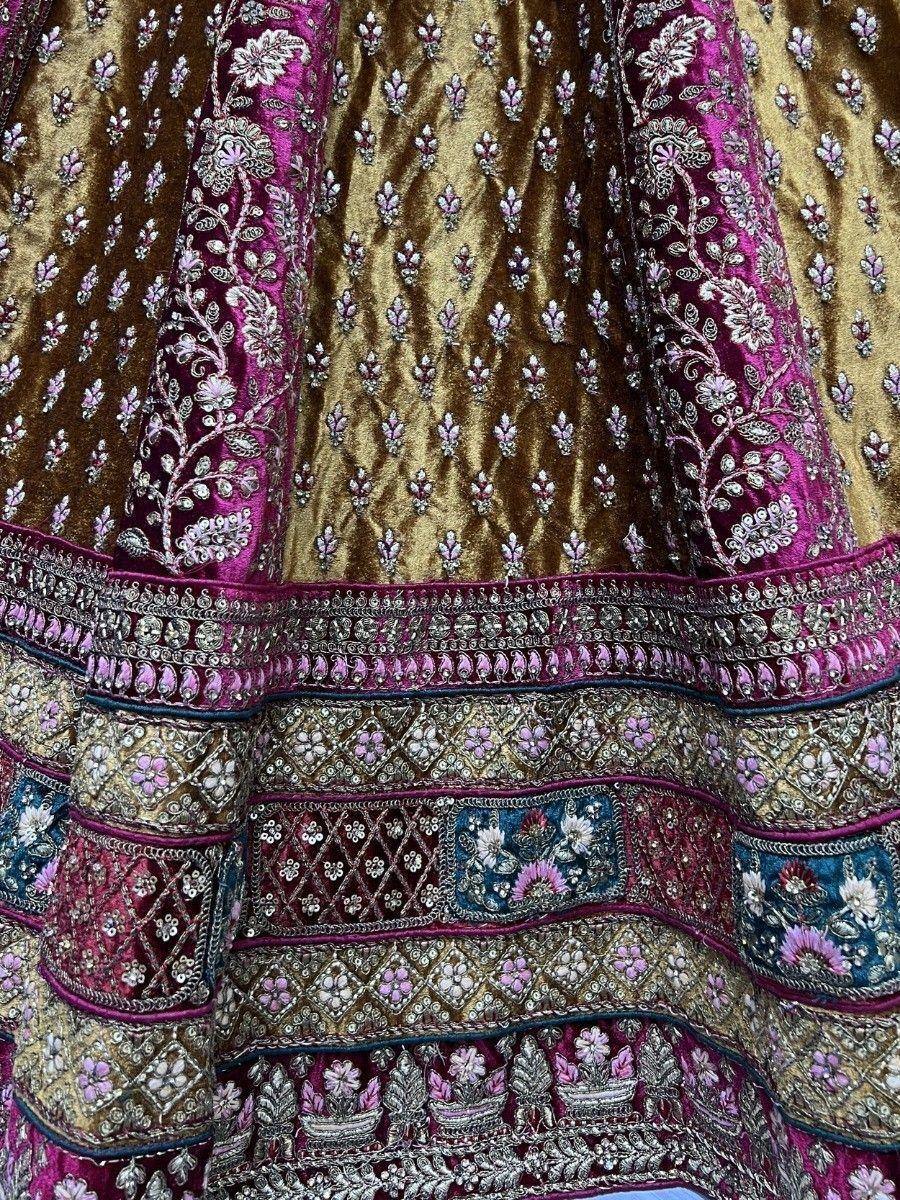Luxury Indian lehenga with gold and magenta velvet, intricate floral embroidery and sequin detailing