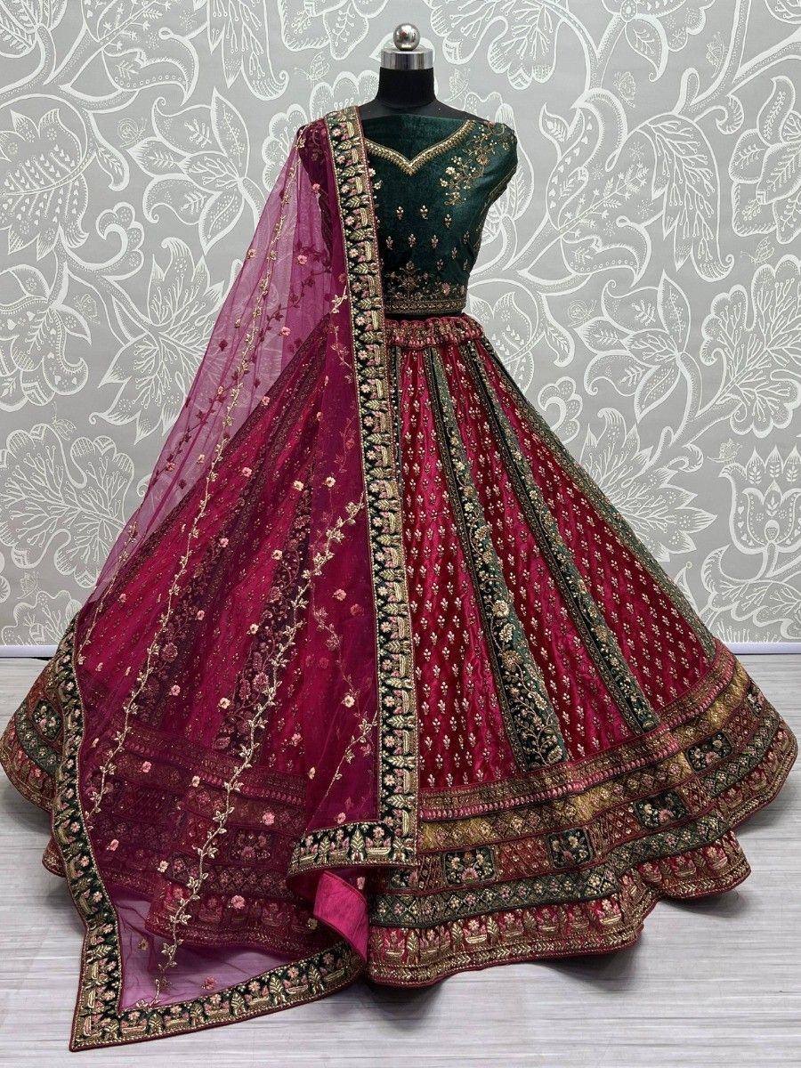 Emerald green and maroon designer lehenga choli with heavy embroidery and net dupatta, perfect for Indian weddings