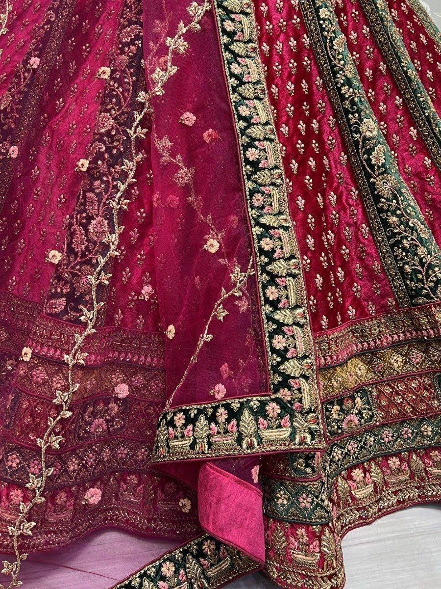 Luxury maroon lehenga choli with intricate gold embroidery and floral detailing, perfect for Indian weddings.