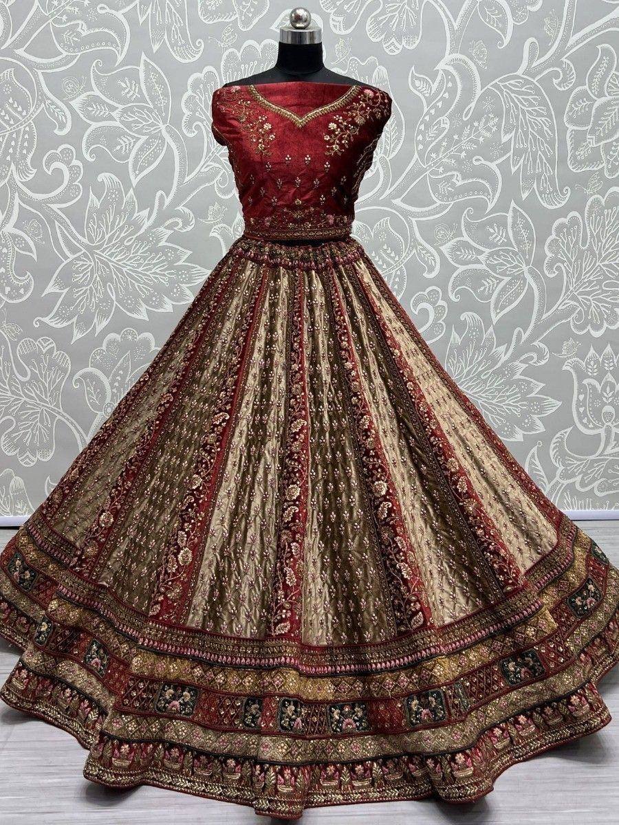 Red and gold embroidered lehenga choli with intricate floral patterns, perfect for Indian weddings and festive occasions.