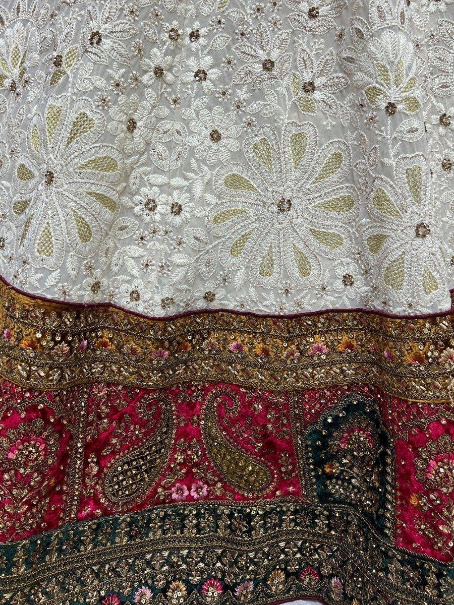 White and pink embroidered lehenga with gold floral and paisley detailing, perfect for Indian ethnic wear