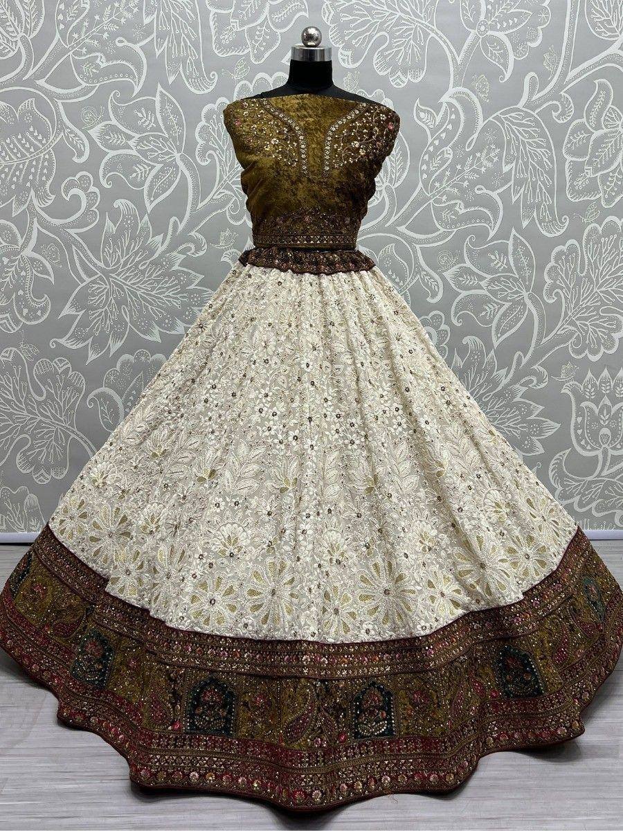 Elegant cream and olive green embroidered lehenga choli with floral motifs and rich border detailing
