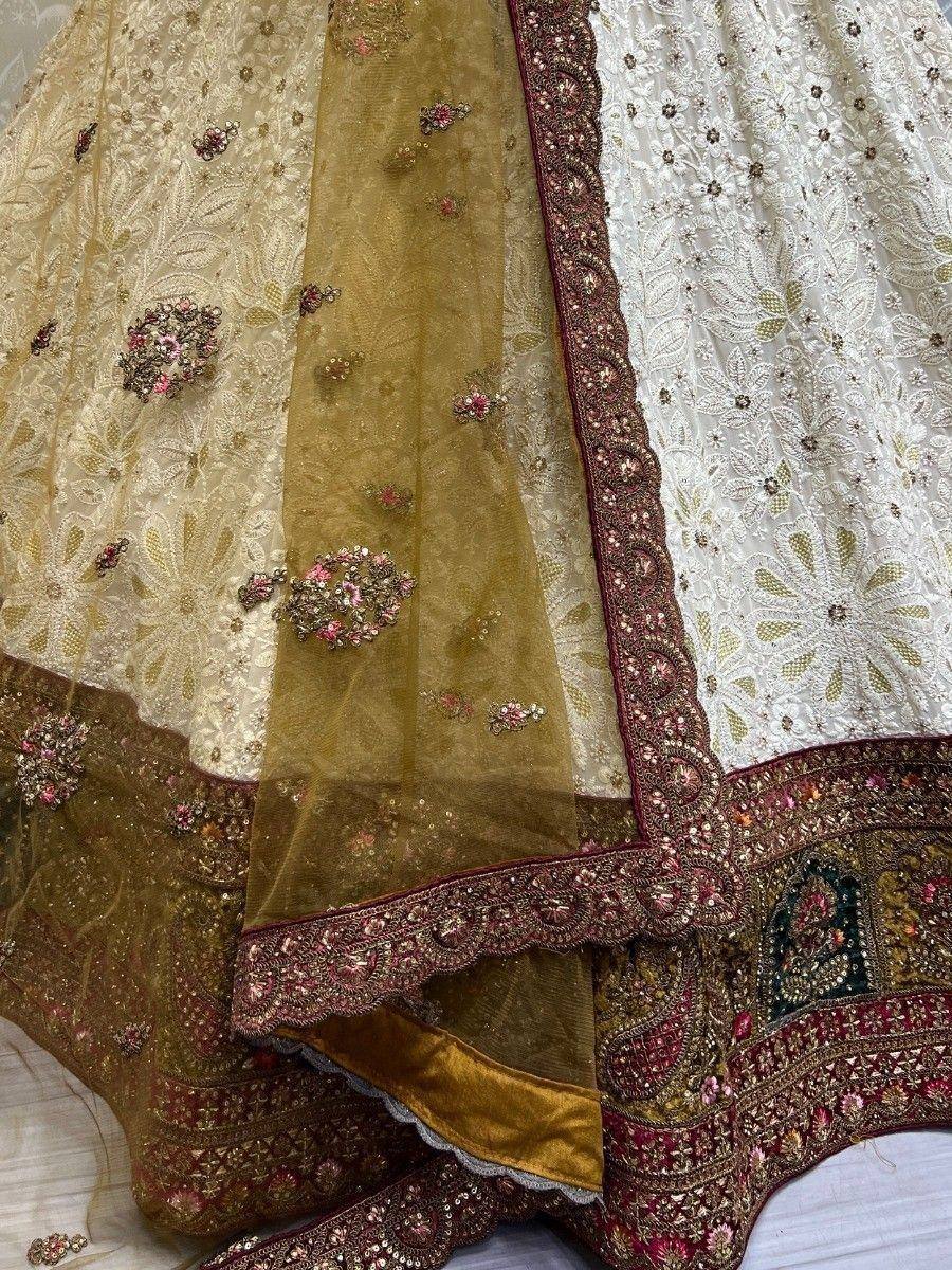 Elegant Indian lehenga choli with floral embroidery and sheer dupatta, perfect for weddings and festivals.