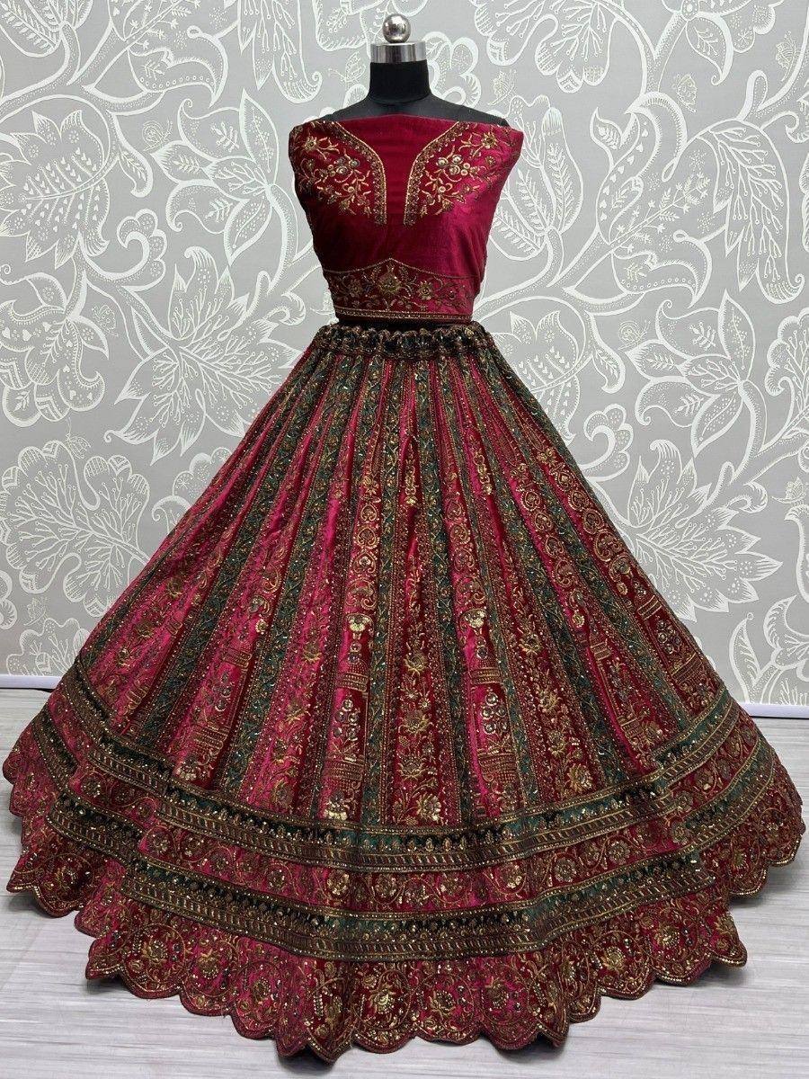Maroon velvet lehenga choli with gold embroidery, perfect for Indian weddings and festive occasions.