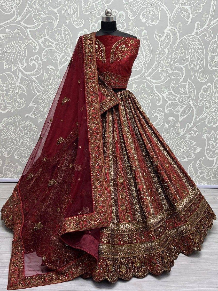 Maroon designer lehenga choli with gold embroidery and net dupatta, perfect for weddings and festivals