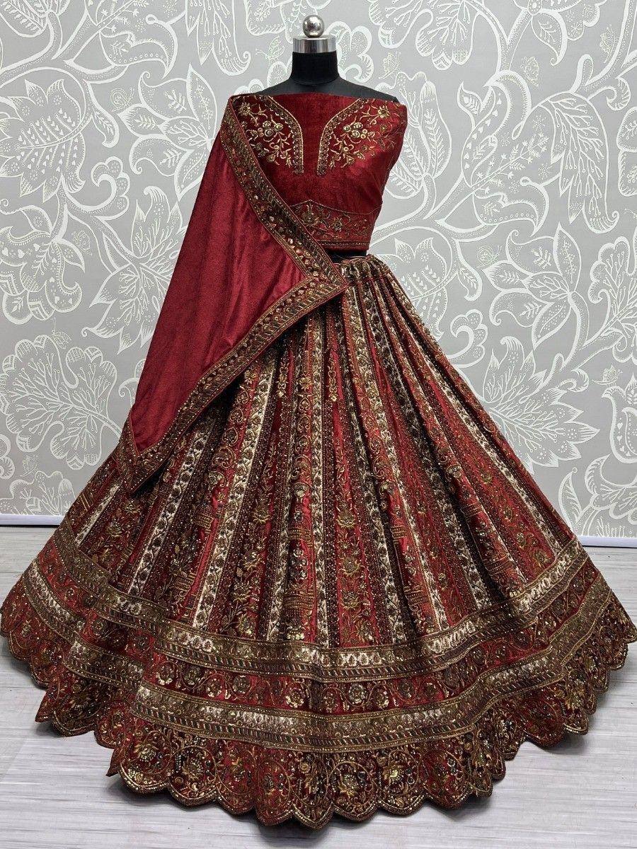 Maroon designer lehenga choli with gold embroidery, perfect for Indian weddings and festive occasions.