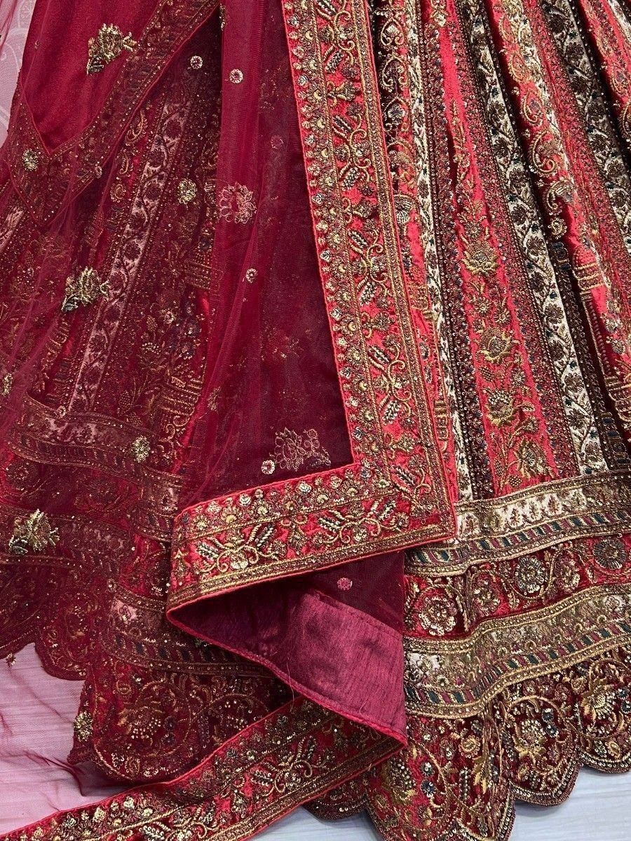 Luxury maroon lehenga choli with gold embroidery and heavy embellishments for weddings